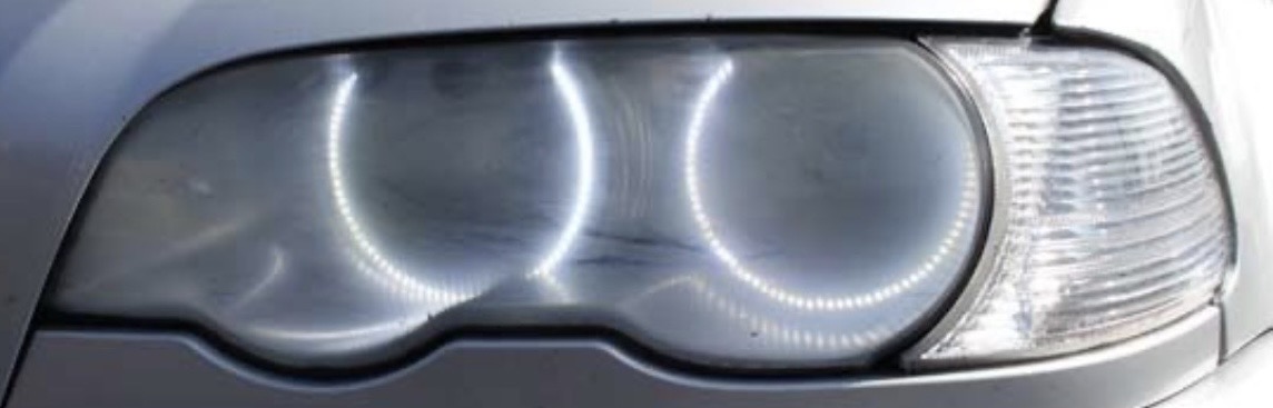 Yellowed oxidized 1990s BMW headlight before restoration