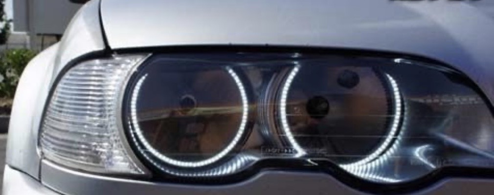 Crystal clear restored 1990s BMW headlight after restoration